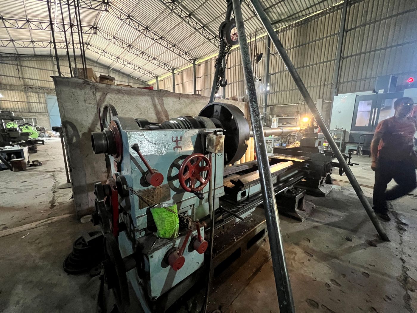 Heavy duty lathe and machining setup at IndoTech facility